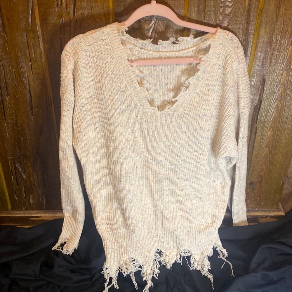 Juniors size small distressed sweater.